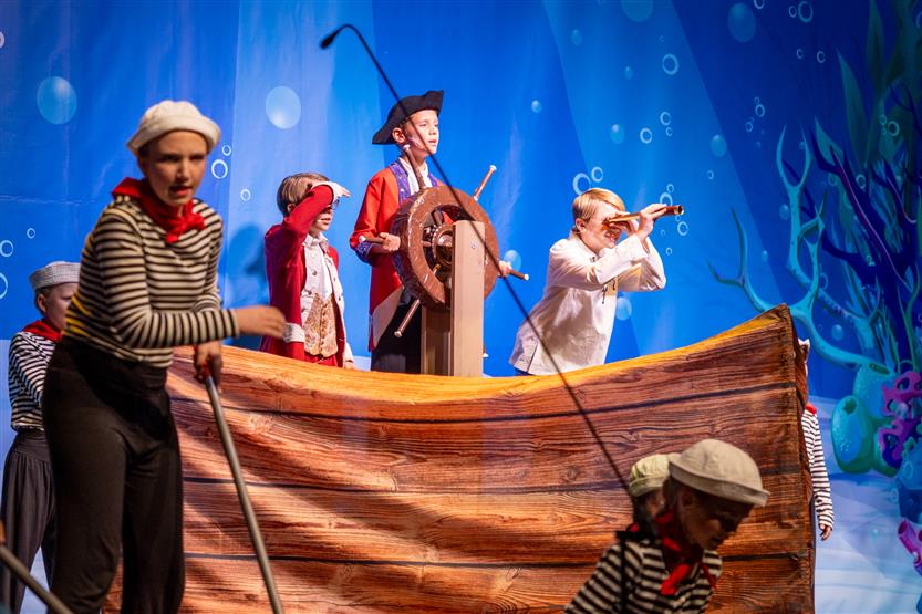 Students perform onstage